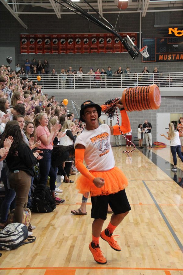  
Chris Finch runs the spirit jar through the gym to gather Mustang and Filly spirit.