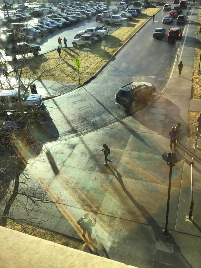 NC students congrugate in the student parking lot after rain storm.