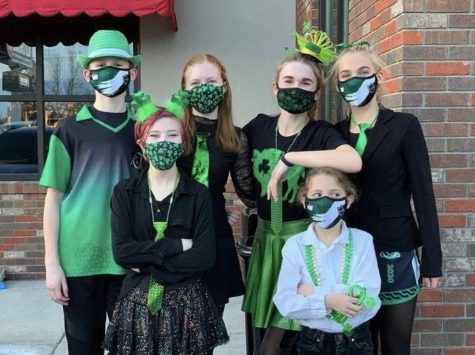 6 Irish dancers wear festive outfits outside of Old Chicago