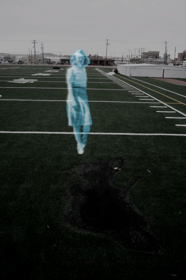 Ghostly girl in 1940s style skirt next to burnt track infield.