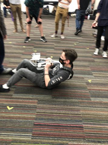 A sophomore boy completes the harness sit-ups event