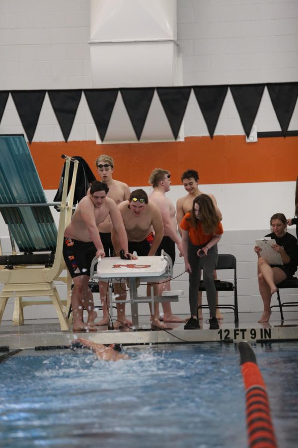 boys team swimming in new pool