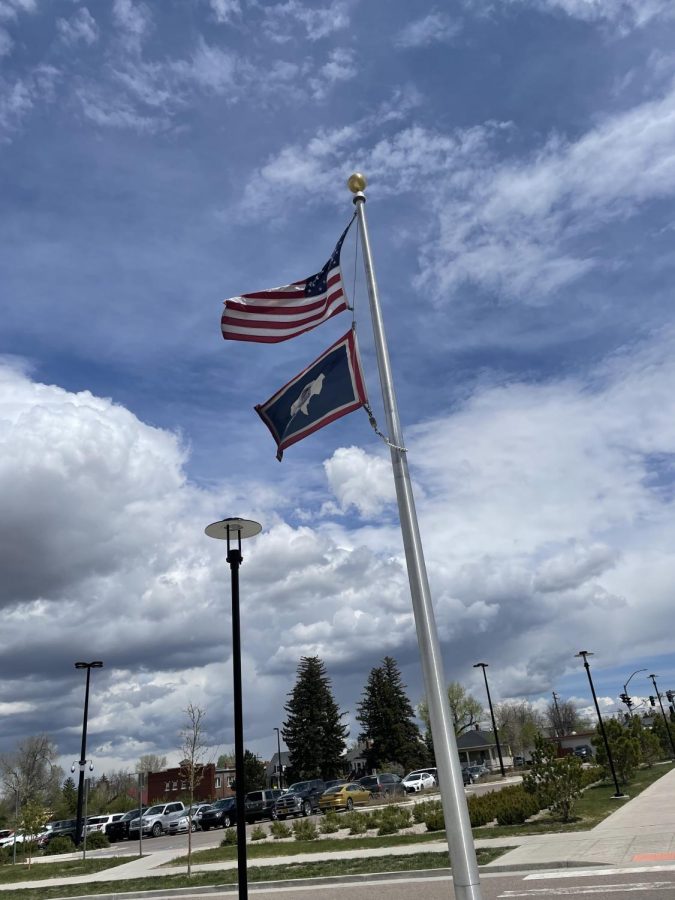 The Wyoming and U.S. flags fly on the flagpole outside Natrona County High School in Casper, WY.