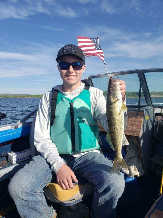 The+author+holds+up+a+walleye+caught+on+Glendo+Reservoir+last+summer.