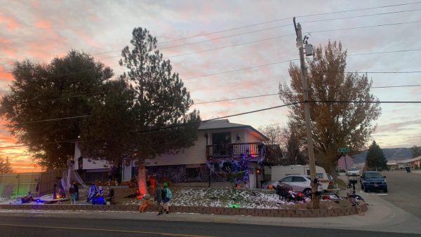 Students are greeted to a Halloween sunrise as they walk past a spooky yard display at the corner of 12th and Pennsylvania. The weather is forecasted to be in the mid-30s with light wind.