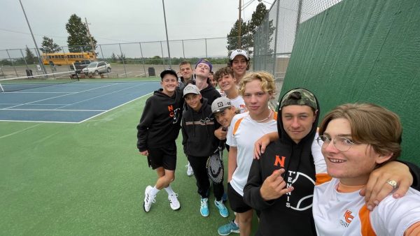 GUYS ONLY
The tennis varsity boys team takes a picture in the rain. “The grind never stops” said Jerome Newmiller (Second from the right).