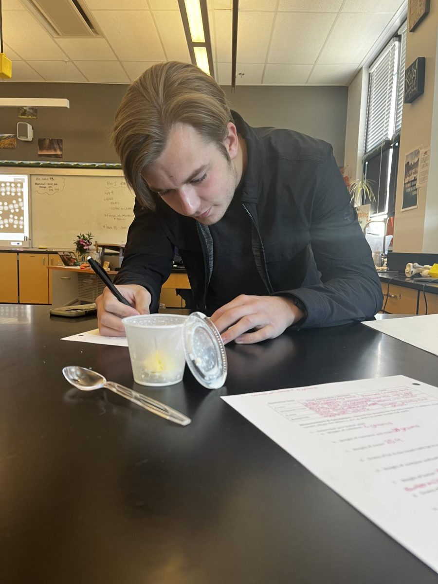 Jason Robberson is hard at work making butter in his IB Science class to reward himself after a hard day’s work with a handmade treat. “It was really interesting learning about the churning process of how butter is made,” said Robberson. “It helped me understand the process of how lipids form clumps, like butter.”