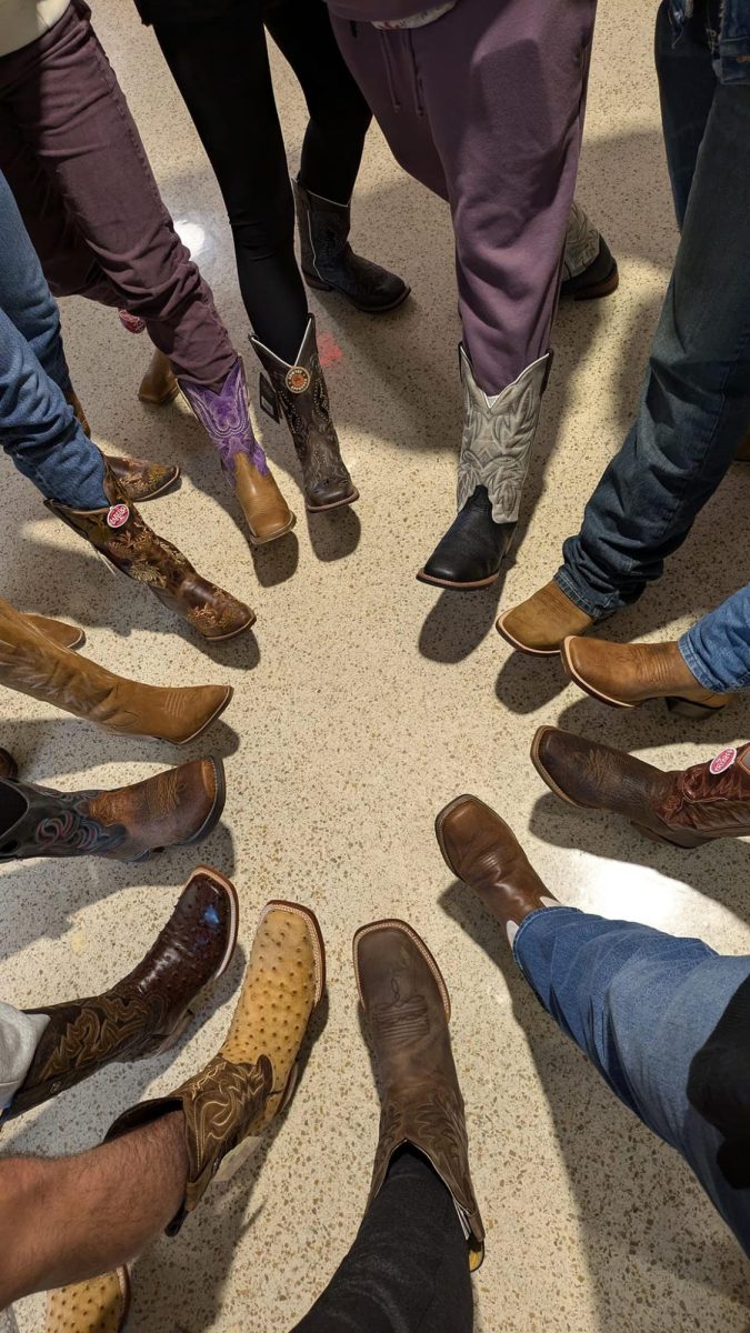 Bunches of boots. Students show off their new boots for the camera. During boot days students and staff are encouraged to wear their boots to school. "It's exciting to be part of something so much bigger than our school and to part of something that really is advocating for the students in our district," said senior Miranda VanTassel.