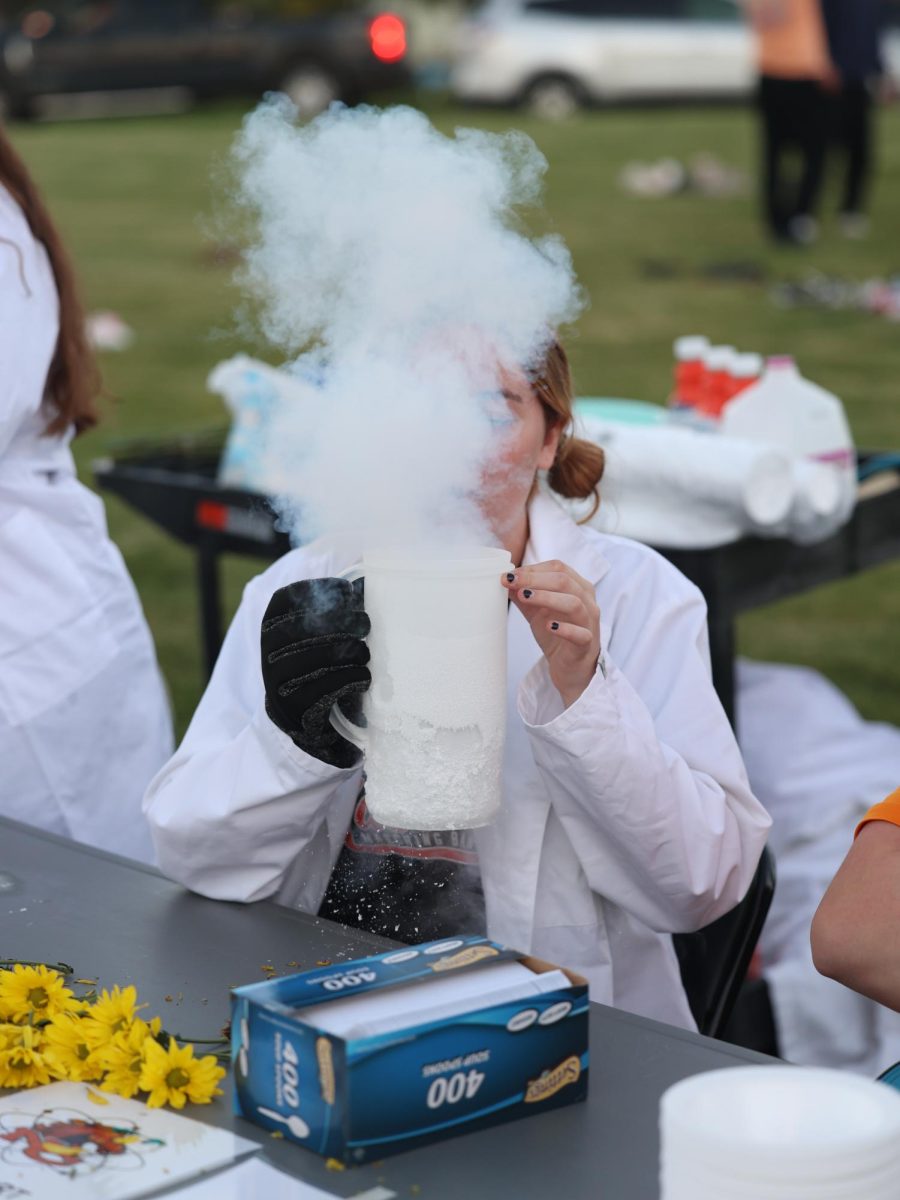 SMOKIN'
The science table shows off dry ice reactions to people visiting their table during NatronaFest on Sept. 25. "They were making ice cream," said sophomore Willow Griffitts.