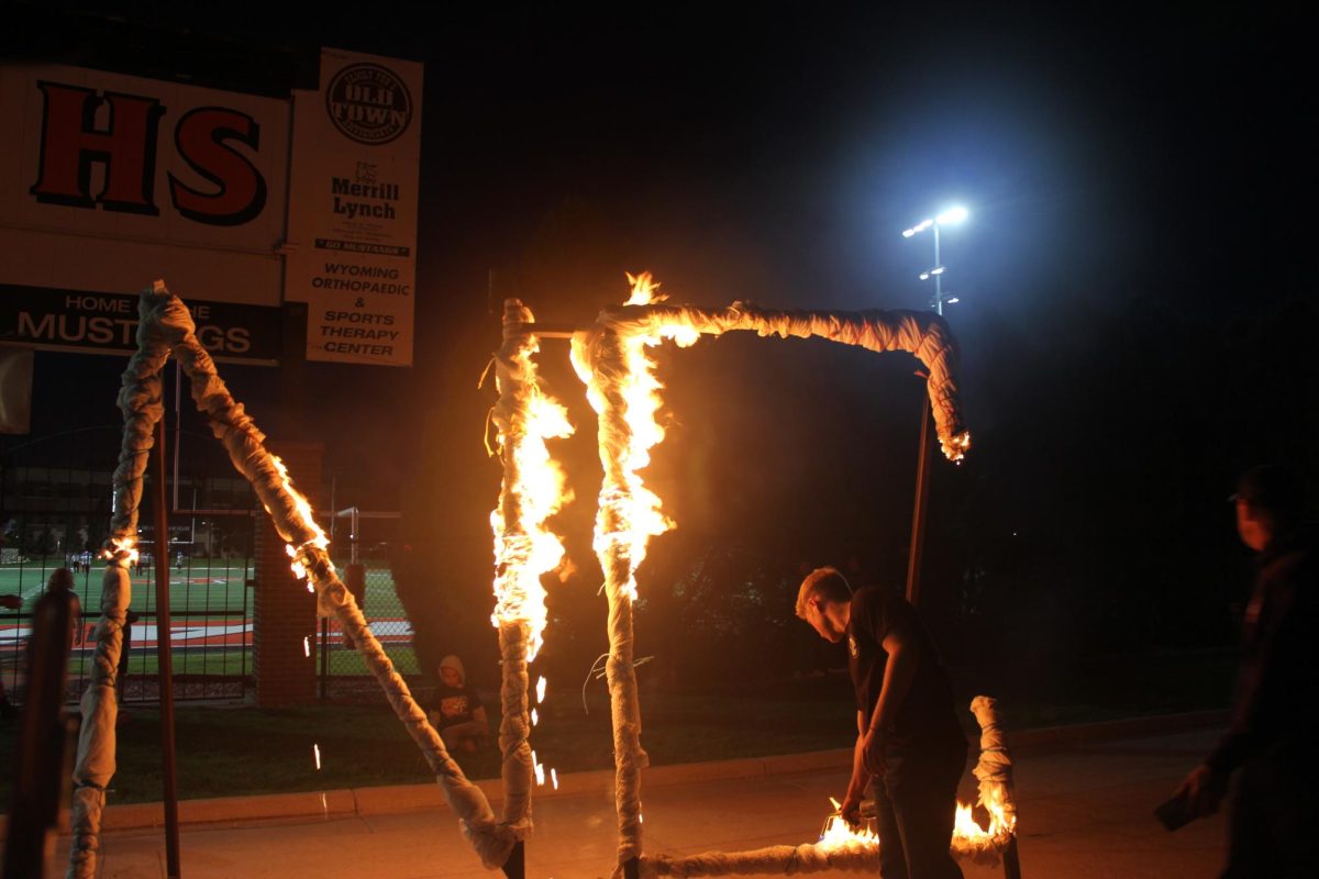 SET AFLAME An NC student sets letters aflame at last year's NatronaFest. This year's NatronaFest will happen September 25 and the NC will be lit at sunset. "You're all united and one thing. And you feel like one purpose. Now what that purpose is at that time, like, it's not necessarily burning the NC, but it's pride," said Assistant Principal James Downs.