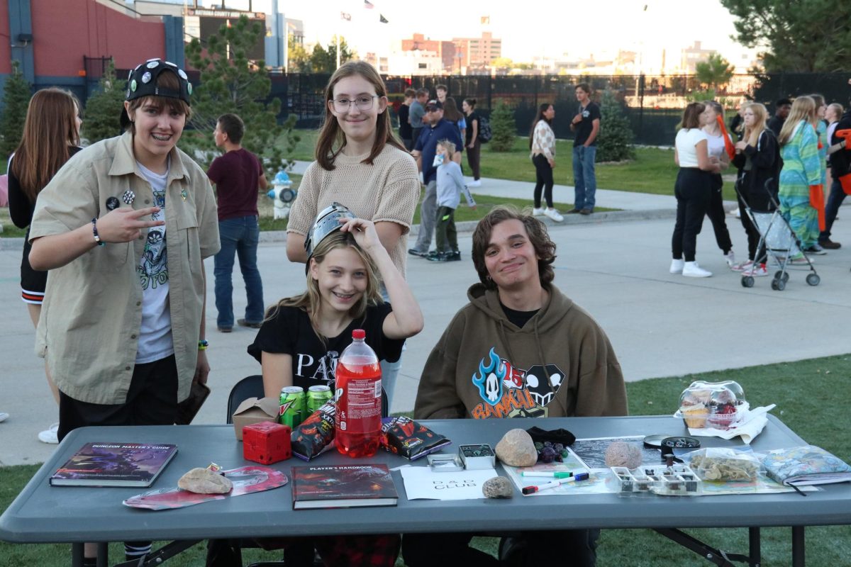 DIGGIN THE DUNGEON! 2024 D&D club members show off their table at NatronaFest. The club will continue again this year. "Passionate and good at explaining" is how Nyomi Kooser described her fellow club members.