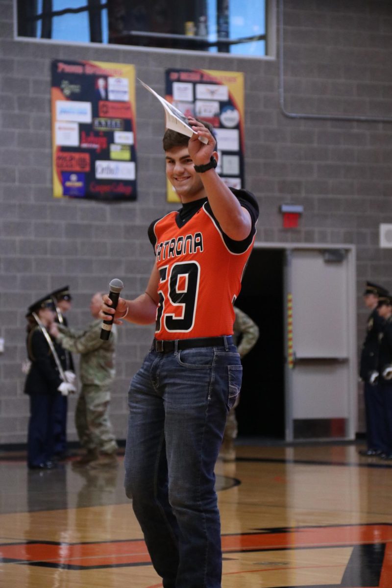 ANNOUNCING Charlie Frausto talks to the student body during the homecoming assembly on Sept 15. Frausto is the senior class president for Student Council.